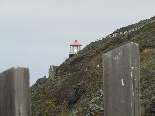 Point Sur Lighthouse peeking about the hill