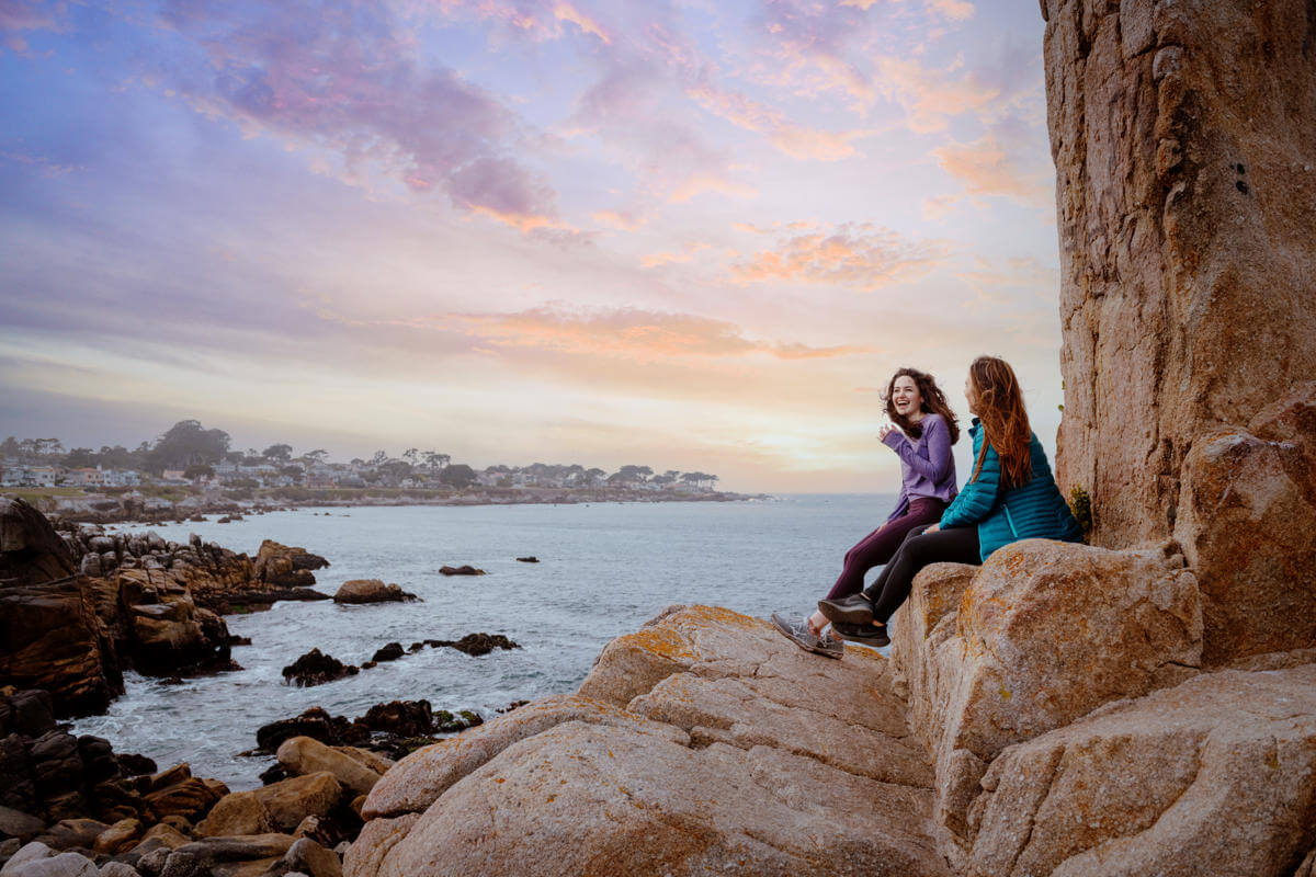 girls on rocks Pacific Grove