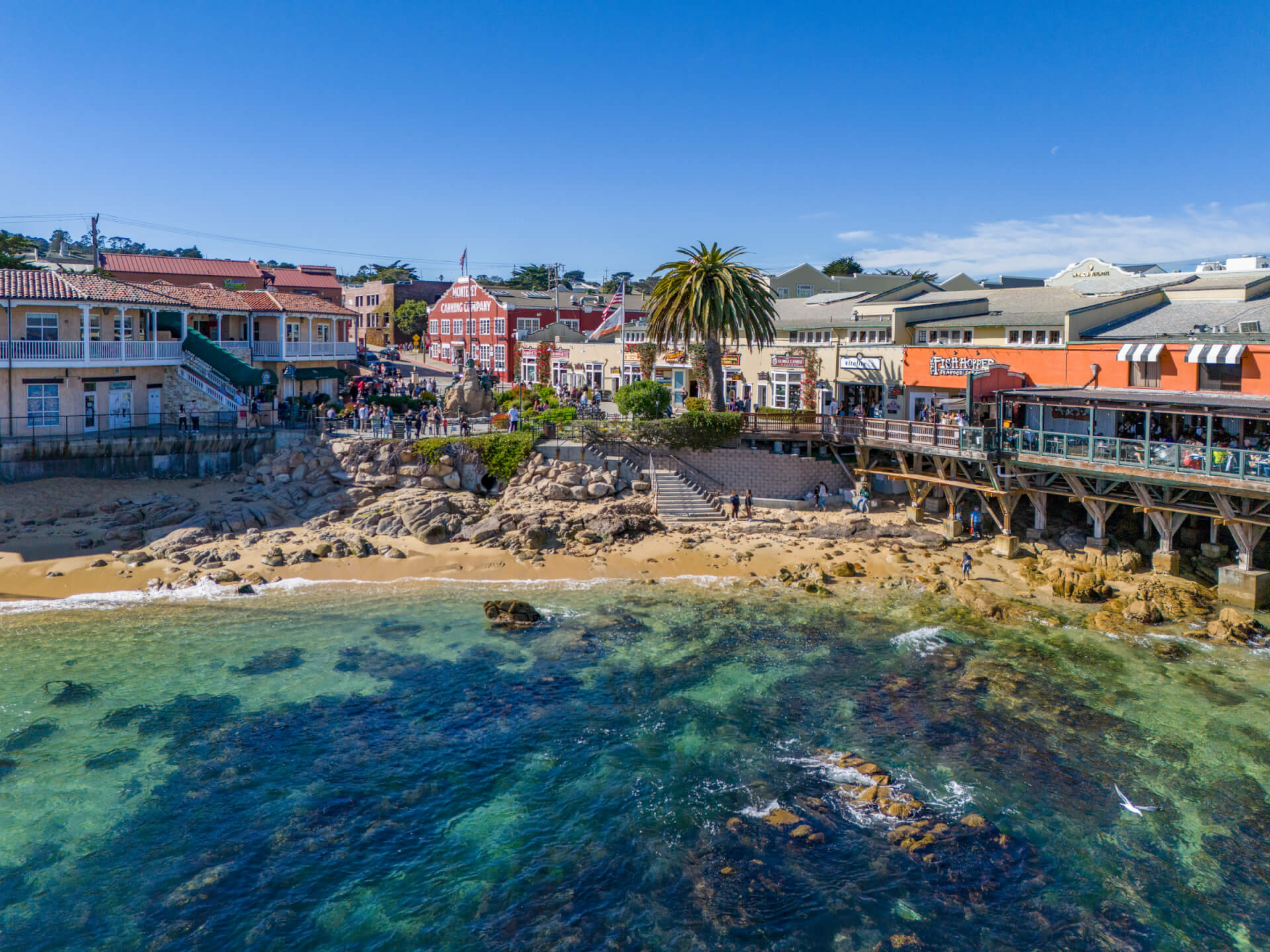 This is an image of the ocean-side shops of Cannery Row in Monterey, California taken from the water