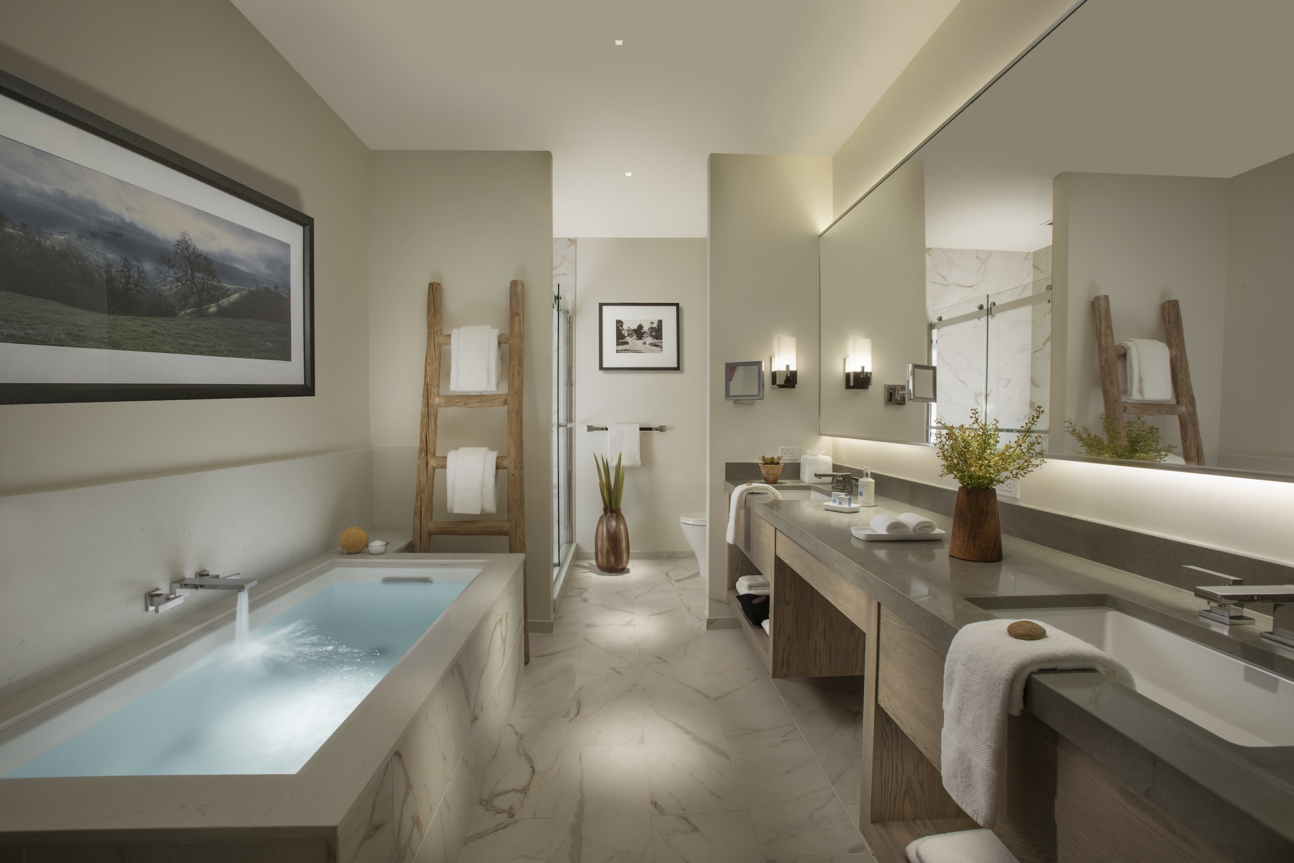 This is an image of a sleek bathroom with tub at the Stilwell Hotel in Carmel-by-the-Sea, California