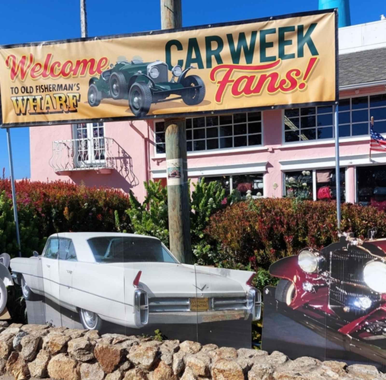 This is an image for the welcome sign for Monterey Car Week at Old Fisherman's Wharf