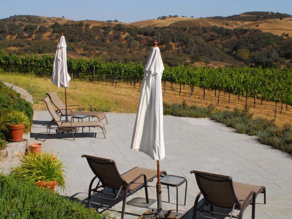 This is an image of the lower patio overlooking vineyards at the Inn at Pinnacles National Park in Soldedad, California