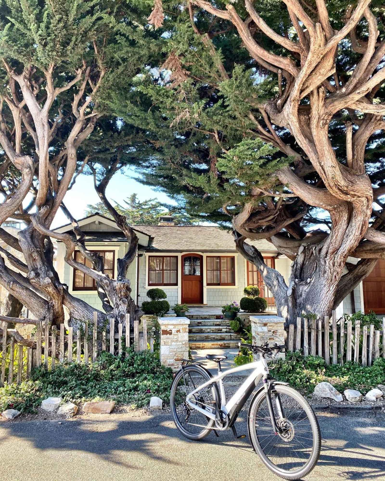 Electric bicycle parked in front of a beautiful home in Carmel.